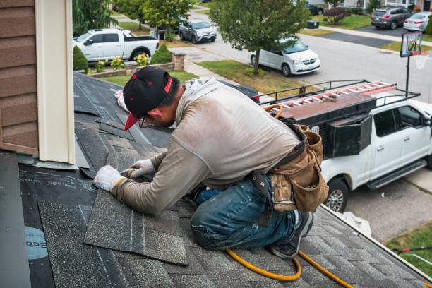 Professional Roofing technician working in Wellesley Hills, MA